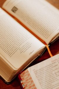 Open Bible with orange bookmark, captured in São Paulo. Perfect for religious and spiritual themes.