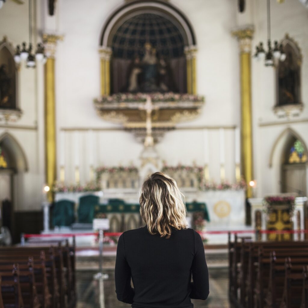 woman praying in the church.jpg